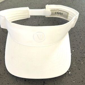 Women’s white Vuori visor with adjustable strap.